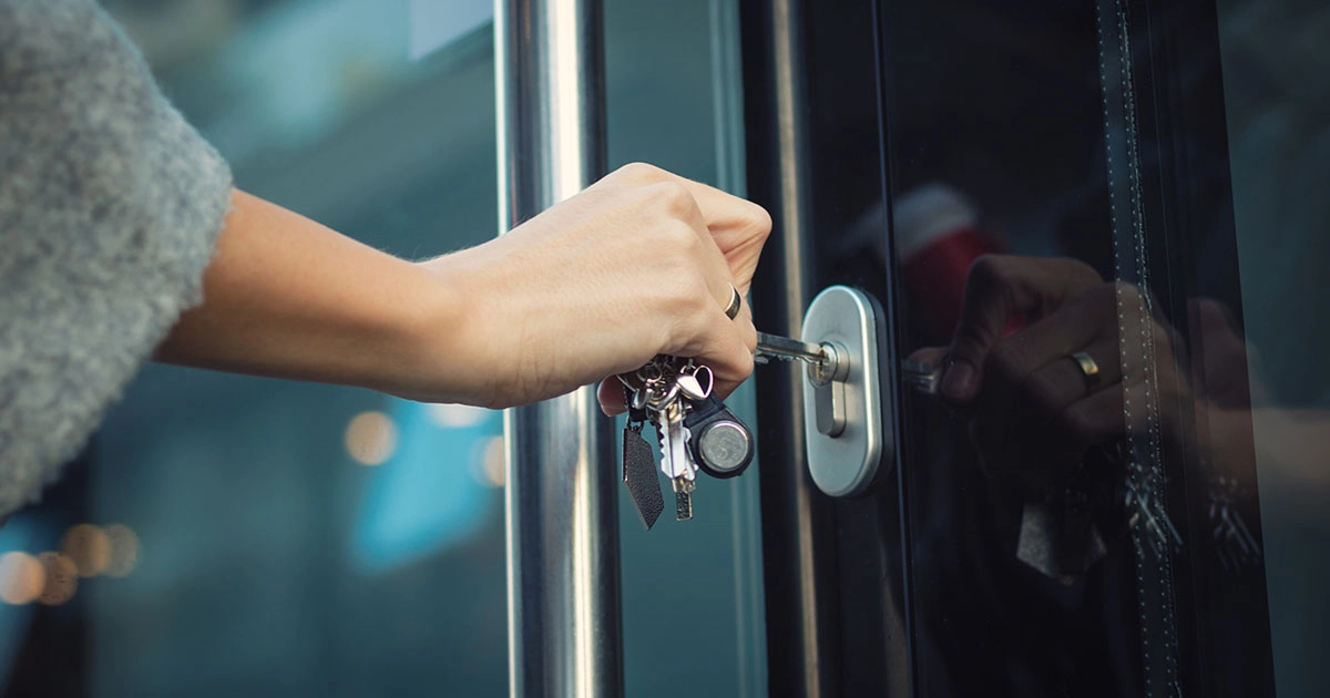 person unlocking door